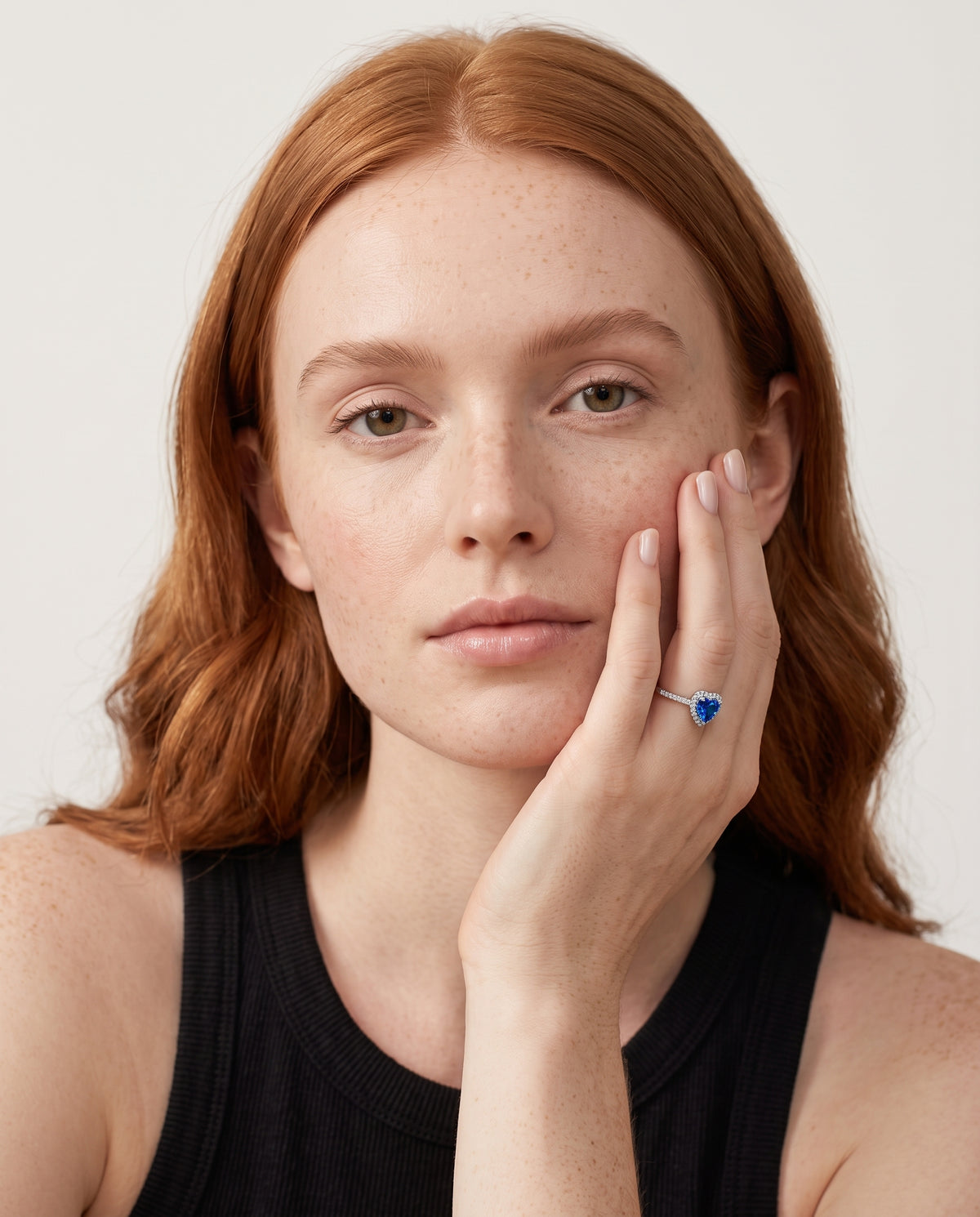 Model wearing the Blue CZ Heart Ring in 925 sterling silver