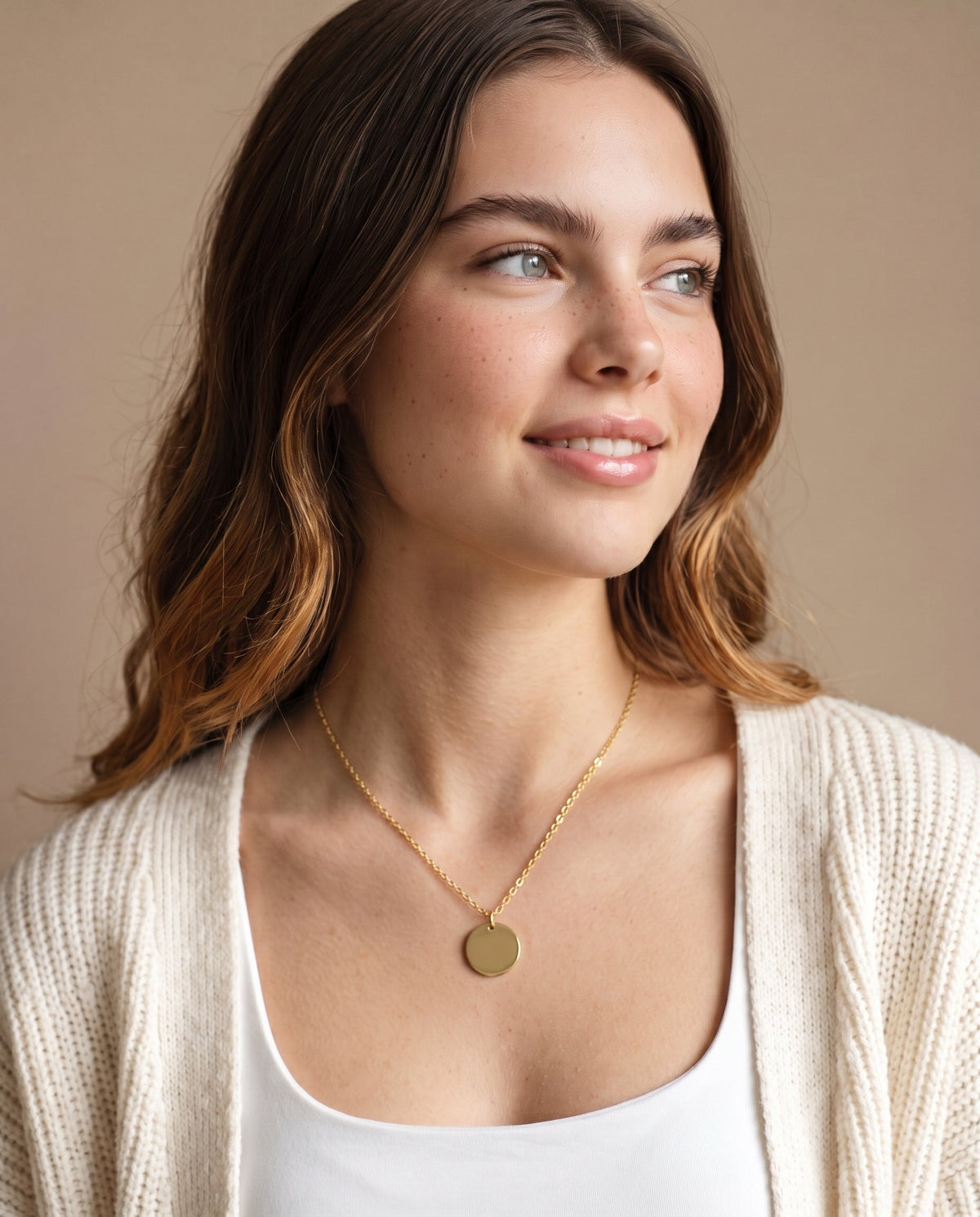 Model wearing the Engraved Coin Necklace in 14K gold-plated 925 sterling silver on a cable chain