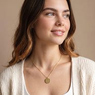 Model wearing the Engraved Coin Necklace in 14K gold-plated 925 sterling silver on a cable chain