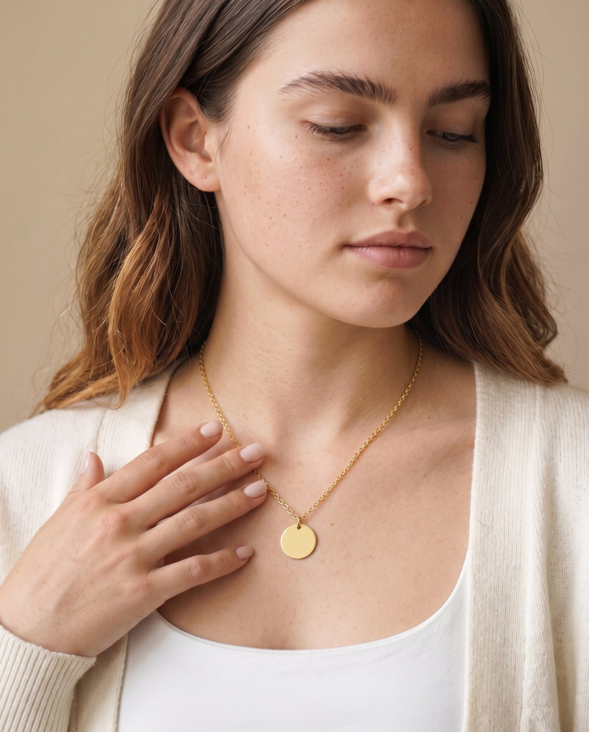 Model wearing the Engraved Coin Necklace in 14K gold-plated 925 sterling silver, second view