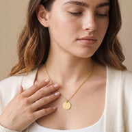 Model wearing the Engraved Coin Necklace in 14K gold-plated 925 sterling silver, second view