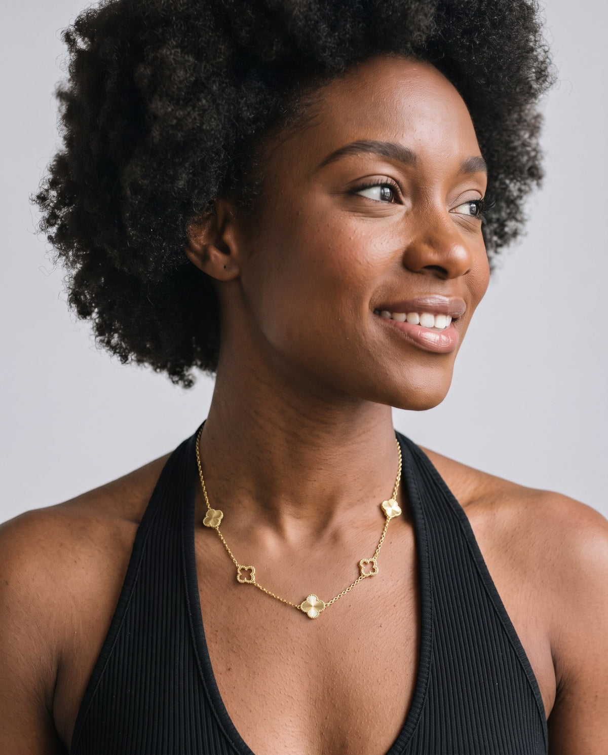 Model wearing the Clover Pendant Necklace in 14K gold-plated 925 sterling silver