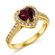 Hand model wearing the 14K gold plated red heart ring, showing the warm band and crimson heart stone. Hallmarked Loretana piece, hand-finished in Kaunas.