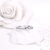 Rhodium-plated 925 silver heart ring featuring a brilliant AAAAA zirconia on white background.