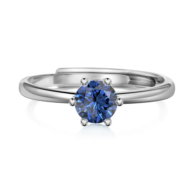 Close-up of the silver birthstone ring highlighting the open-back adjustable 925 sterling silver band.