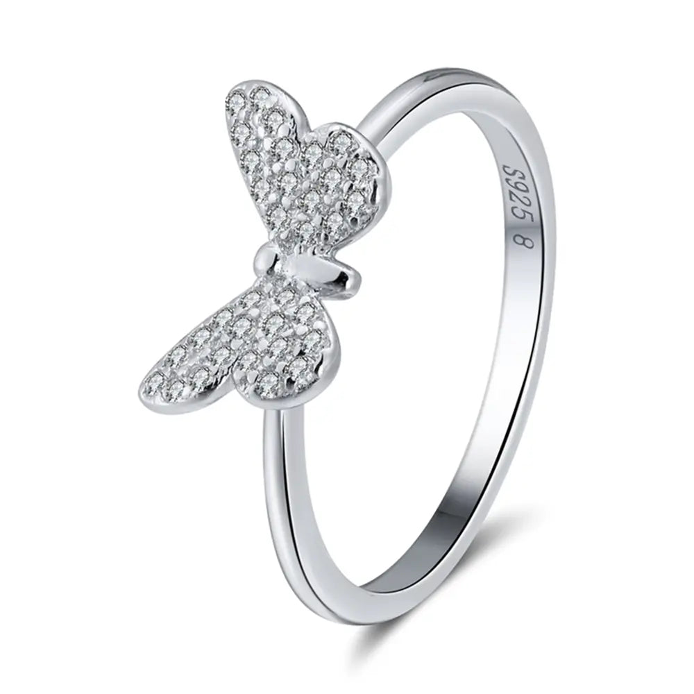 Close detail of the silver butterfly filigree ring showing pierced openwork wings, AAAAA cubic zirconia along the edges, rhodium plating over 925 sterling silver. Hallmarked Loretana piece, hand-finished in Kaunas.