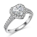Hand wearing the rhodium-plated 925 silver white heart ring, its heart-cut AAAAA cubic zirconia catching the light.